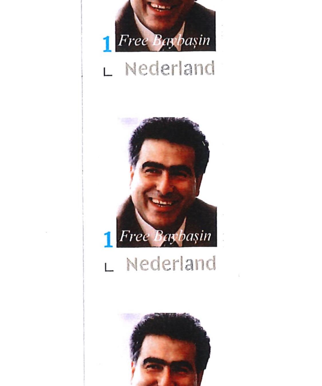 HÜSEYİN AMCANIN FOTOĞRAFININ ÜZERİNE İNGİLİZCE OLARAK "BAYBAŞİN'E ÖZGÜRLÜK" YAZISININ YAZILI OLDUĞU YENİ BİR POSTA PULU